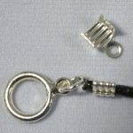 Leather crimp (top) can be used to attach a clasp to a string of leather (bottom)