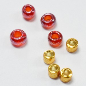 Seed beads: Size 11 rocailles in red with size 11 Delicas in gold